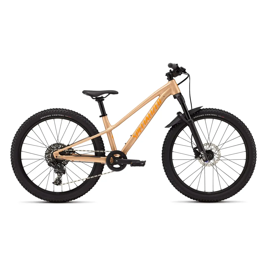 Beige mountain bike frame with knobby tires, front suspension, and handlebars visible against white background (partial shot)