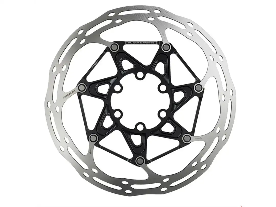 Bicycle disc brake rotor with a silver outer ring and black spider-shaped center, shown in close-up.