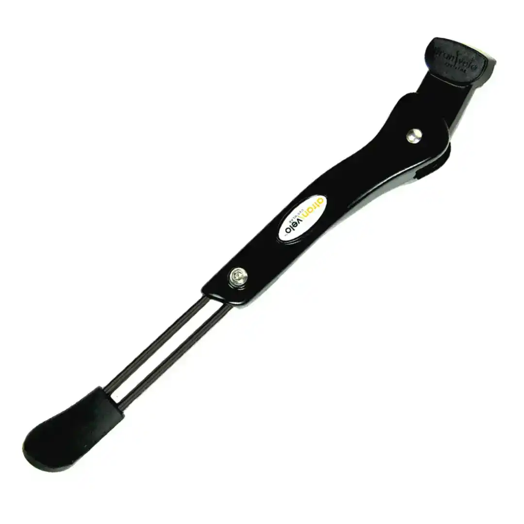 Close-up of a black handheld soldering iron with a flat metal tip, angled toward the top-right.