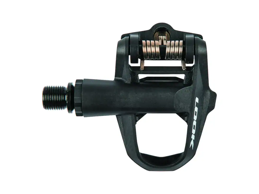 Close-up of a black clipless bicycle pedal with a visible spring mechanism and threaded spindle, brand LOOK visible on the body.