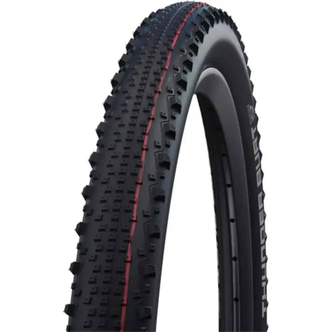 Close-up of two knobby off-road bicycle tires with aggressive tread blocks and a red stripe along the sidewall, angled as if forming a loop.