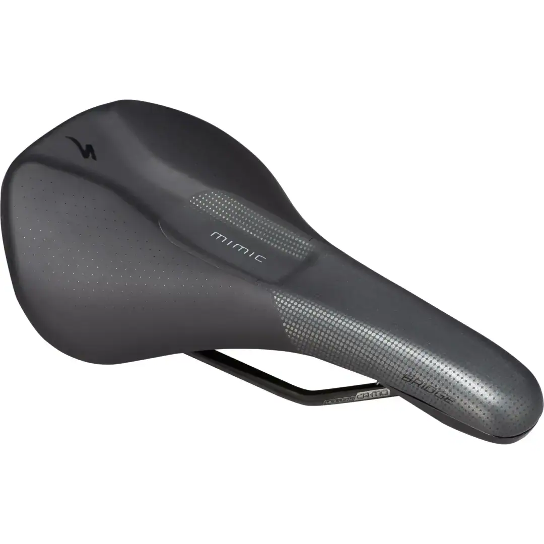Close-up of a sleek black bicycle saddle with perforated texture and subtle branding on the side