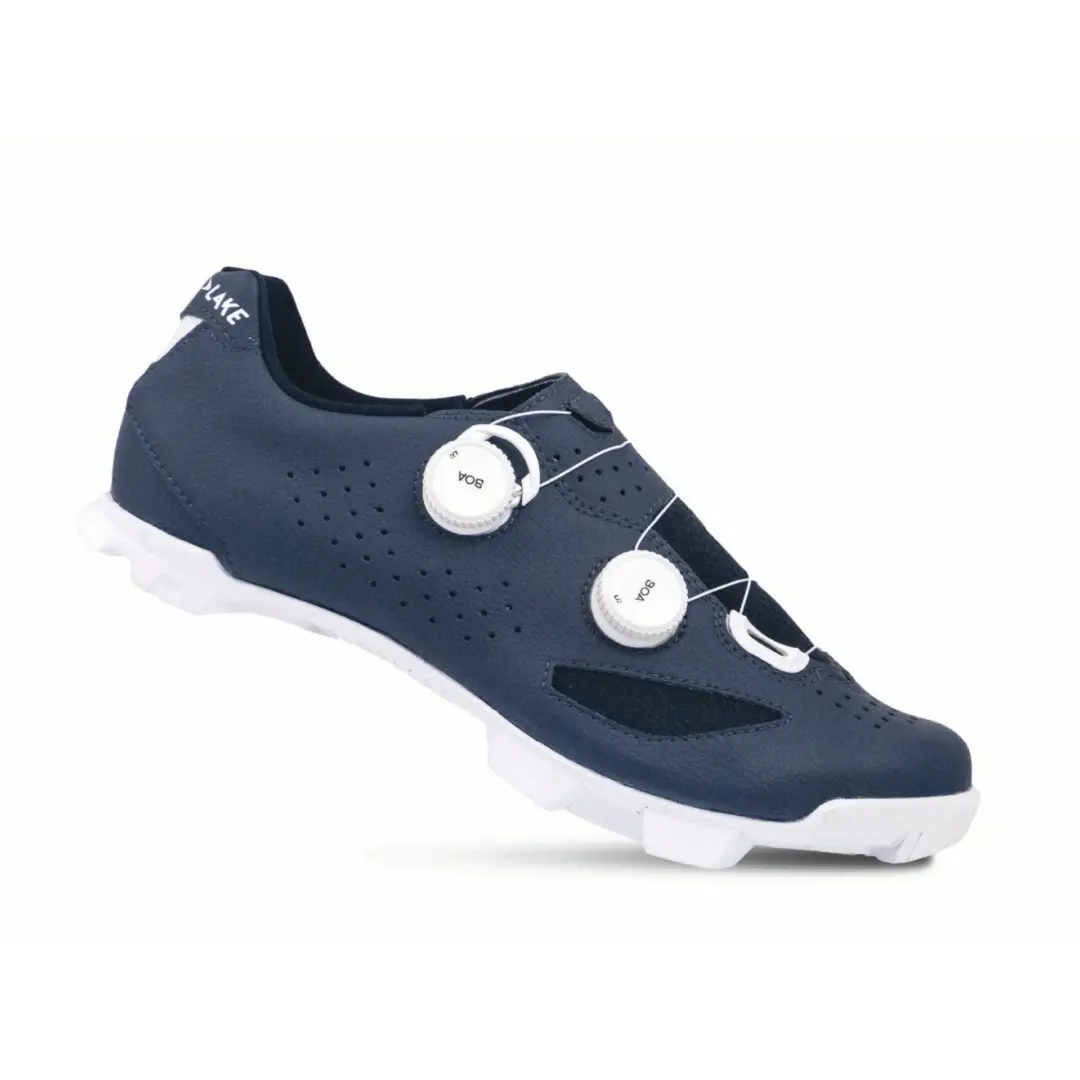 Navy blue sneaker with a white sole and visible dial lace system on the upper.
