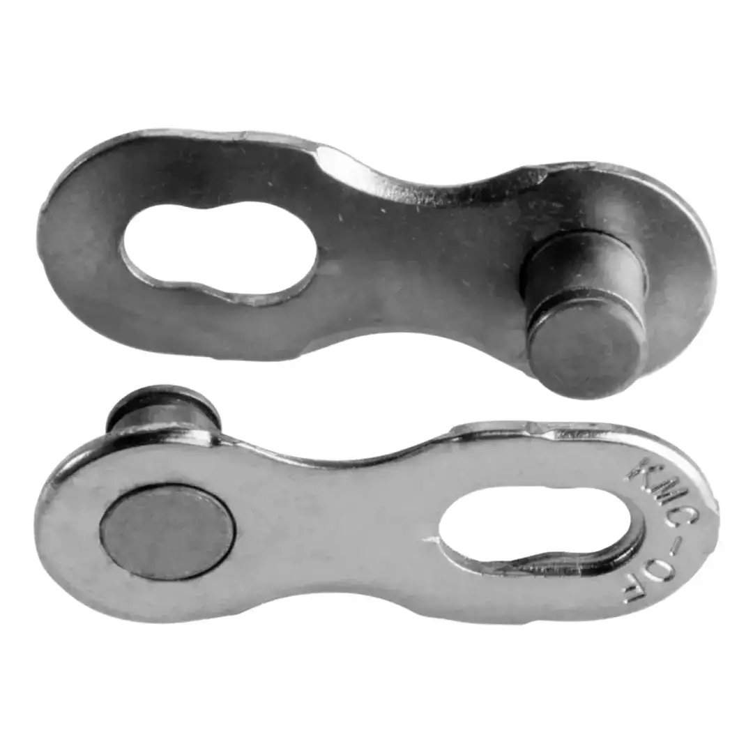 Close-up of a dark metal bracket with an oval hole and rounded rivet joints, part of a mechanical linkage.