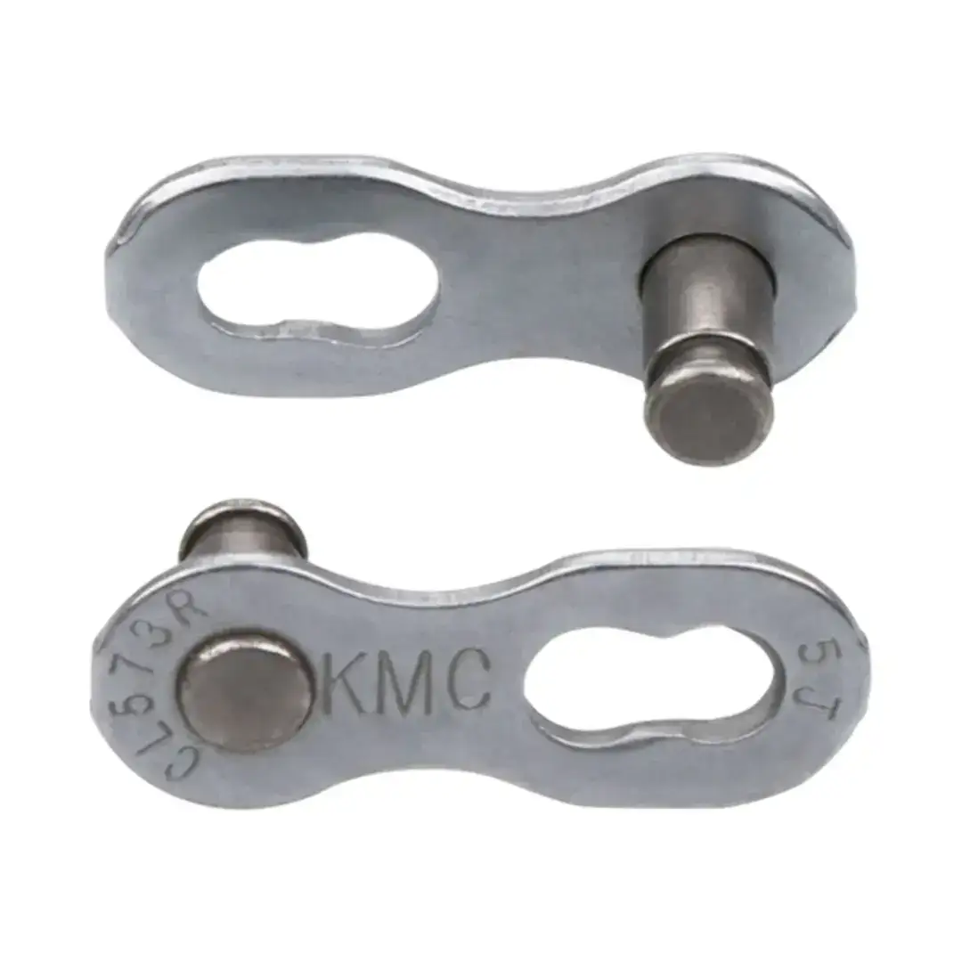 Close-up of a silver metal chain link plate with a riveted pin and gaps for links