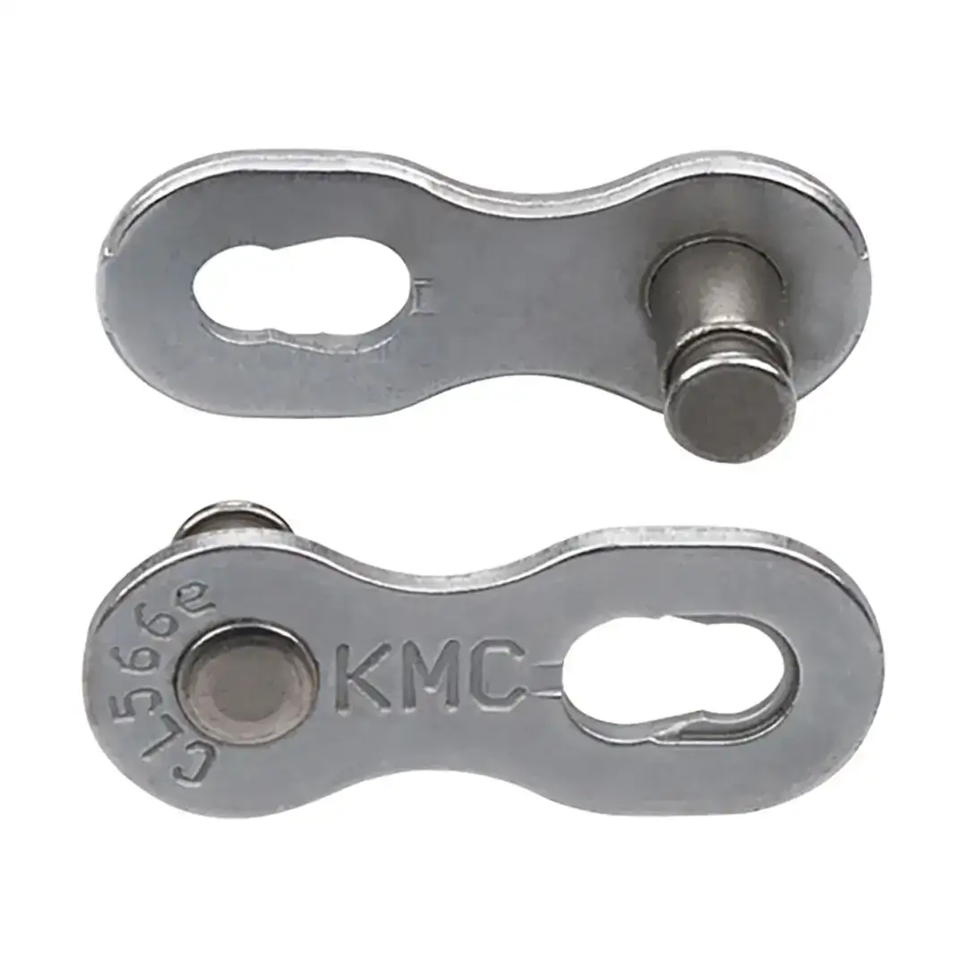 Metal bracket with two circular holes and a bolt, part of a mechanical linkage; shows curved ends and embedded inset text (KMC).