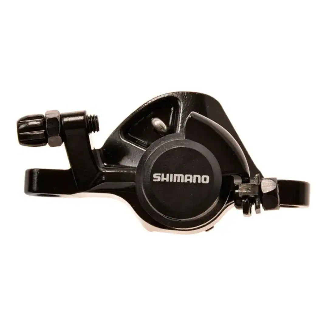 Close-up of a black Shimano bicycle gear shifter with a knurled adjustment knob visible on the left side.