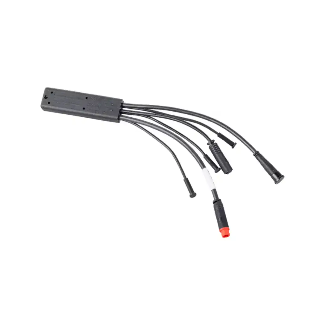 Black rectangular multi-output power adapter with multiple cables fanning out and various connectors at the ends (barrel plugs).