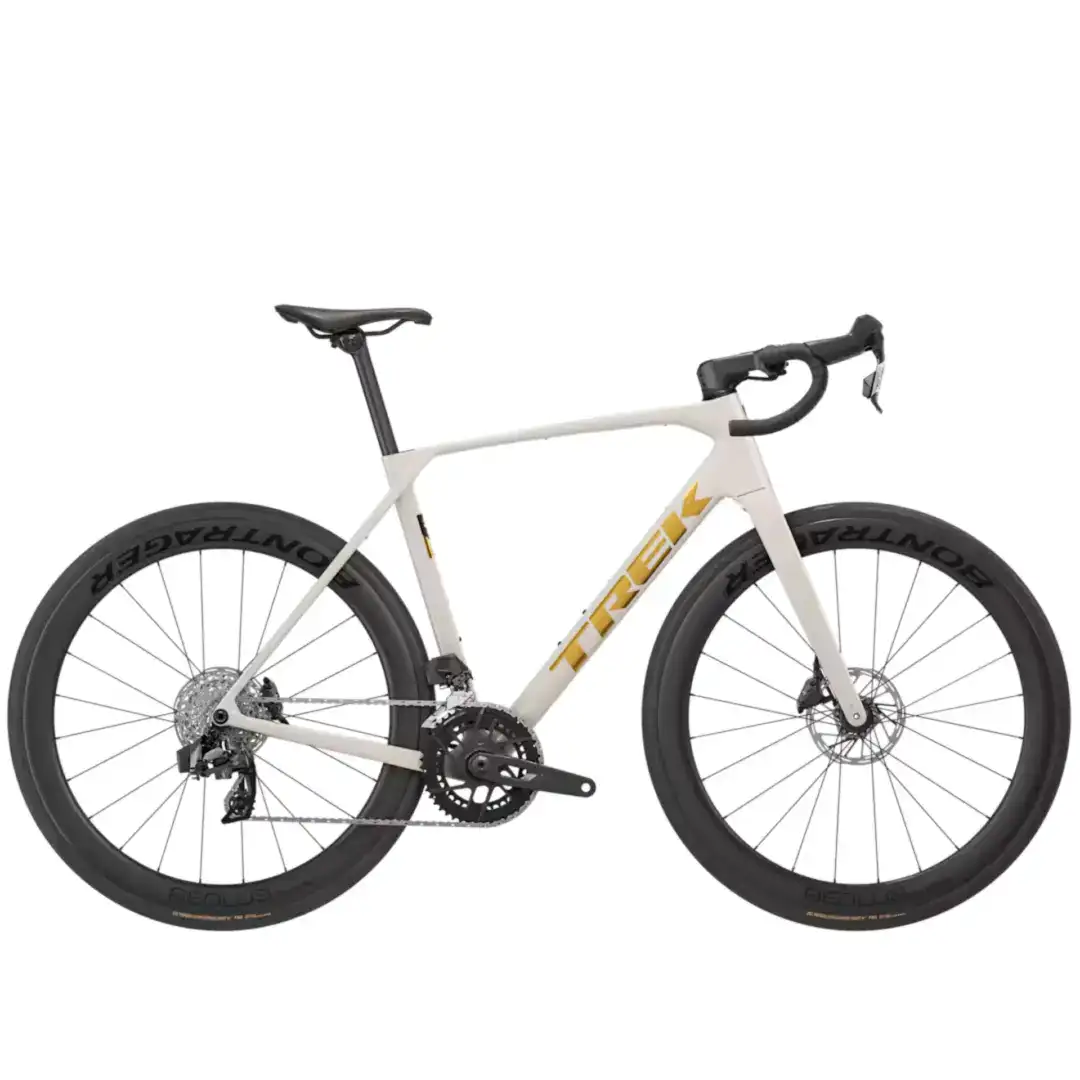 Partial view of a white road bike with drop handlebars and large black wheels with disc brakes.